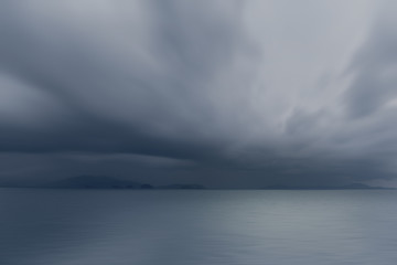 Dramatic storm cloud over the sea, natural photo background.