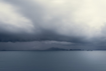 Dramatic storm cloud over the sea, natural photo background.