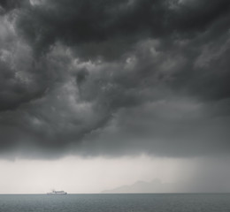 Dramatic storm cloud over the sea, natural photo background.