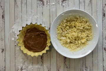 Steps of cooking a gluten free coconut and caramel pie on a wooden background