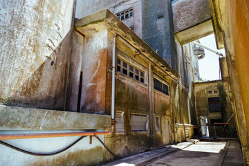 Fototapeta na wymiar Internal corridors of silos and abandoned warehouses with tower