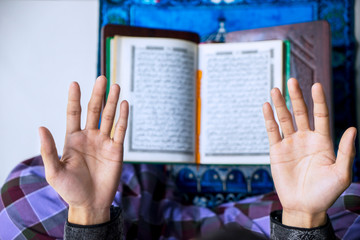 Fototapeta na wymiar Young man hands praying to the Allah
