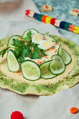 Children's salad with crab and cucumber slices 