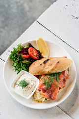 healthy fresh smoked salmon sandwich with egg and sour cream