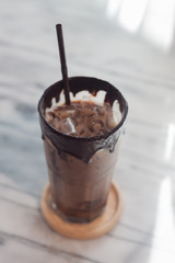 Ice coffee on wooden table