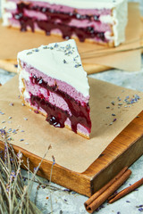 Lavender cake on a wooden board with parchment paper