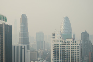 Smog covers the buildings, the sky that are seriously overcast for public health, air pollution with PM2.5 air quality index (AQI) reaching dust and danger level