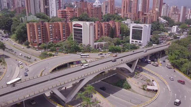 Aerial slow tilting shot revealing glorieta Aguacatala in Medellin