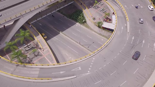 Tilting aerial slow shot of glorieta Aguacatala and Envigado in Medellin
