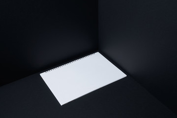Notebook floating on mockup three dimensional black background