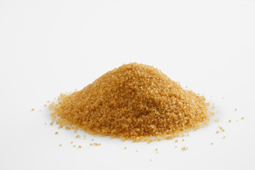 Pile of brown sugar from sugar cane reed, Sucrose sugar white background