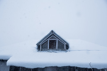 Winter house covered with layers of snow, close-up, snowfall - Image
