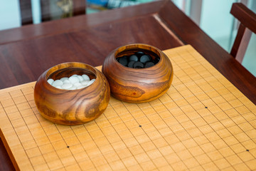 Go placed on the wooden main table