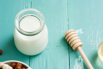breakfast cereal with milk, on blue wood table