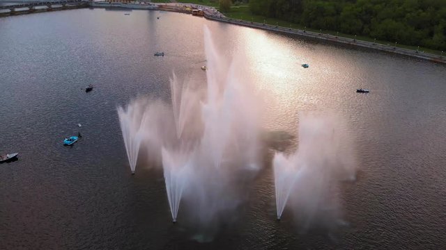 High fountains at sunset. Air shooting from the drone