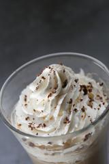 ice Viennese coffee in a glass on a grey background