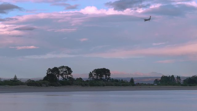 Early morning flight arriving at Nelson airport, New Zealand. Landing to the south with sea birds active.
