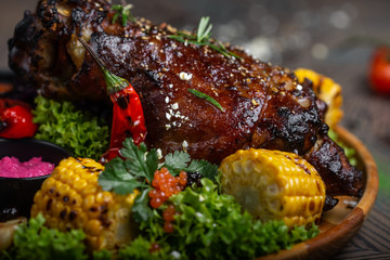fried pork with vegetables and sauce on the plate