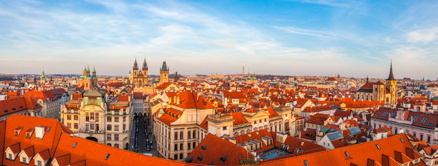 Panorama of warm evening light falling on Prague from above