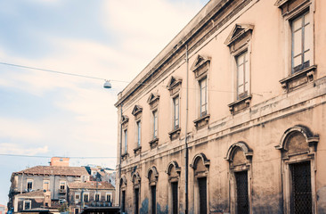 Fototapeta na wymiar Sicily, beautiful cityscape of Italy, historical street of Catania, facade of old buildings .