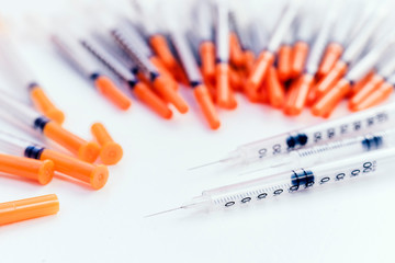 Pile of medical syringes for insulin for diabetes .
