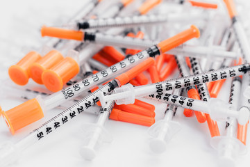 Pile of medical syringes for insulin for diabetes .