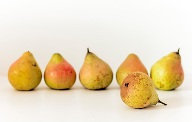 Fresh ripe pears on white background, vegetarian concept.