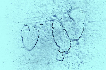 Vintage blue background. Rough painted wall of sapphire color. Imperfect plane of blue colored. Uneven old decorative toned backdrop of cyan tint. Texture of sapphirine hue. Ornamental stony surface.