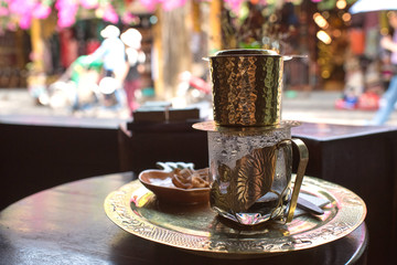 Vietnamese coffee with street view of Hoi An,...