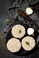 Raw fresh cutlets burger from beef for homemade burgers cooking with spices on black board. Top view. Free space for your text.