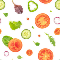 A seamless pattern of fresh vegetables and salad leaves. Tomato, cucumber, onion and pepper slices with mezclun on a white background, a vegan repeat print