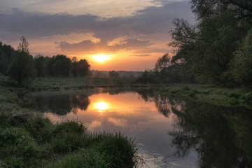 Beautiful sunset in spring by the river