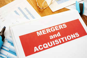 Mergers and Acquisitions M&A agreement and business papers.