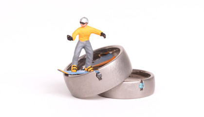 Small snowboarder on two wedding rings