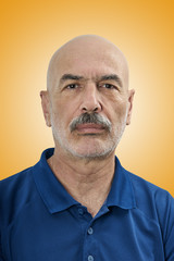 Obraz premium Portrait of Handsome Bald Mature Man on Color Background