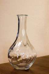 Glass vase on wooden background. Vase close-up.