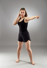 Fototapeta na wymiar Kickboxing fighter girl