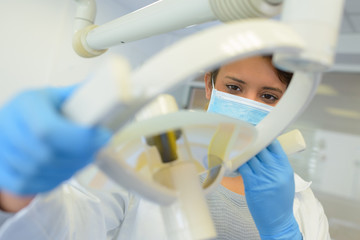 dentist doing a panoramic teeth x-ray in dental clinic