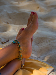 Legs of a woman at the beach