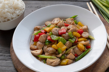 Vegan asian food mix vegetable fried include red yellow and green sweet pepper with onion and meat substitute mushroom for protiene.close up photo vegetarian concept.