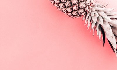 Summer minimal pink composition. Creative layout made of pineapple on pastel pink background. Flat lay, top view, copy space