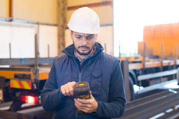 factory worker using handheld scanner