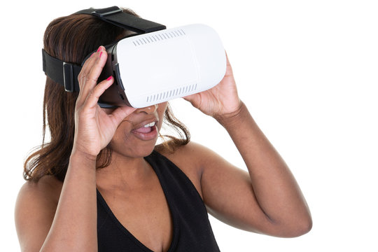 Woman in VR headset looking up and trying to touch objects on white background