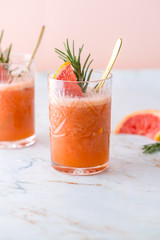 Grapefruit cocktail or mocktail on marble table top
