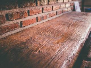 Wooden bar with brown wall with light on morning.