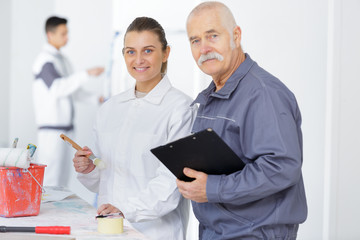 posing together with the industrial painting teacher