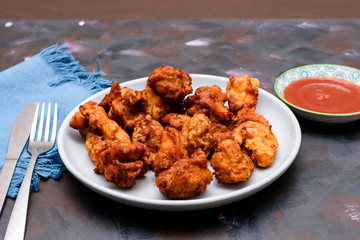 Chicken sixty five, a spicy fried chicken dish in India, Singapore and Sri Lanka.