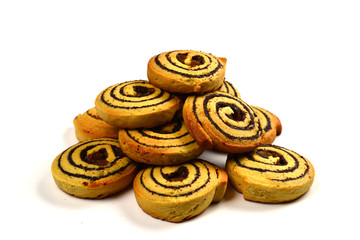 Baked cookies with raisins and poppy seeds isolated on white background.