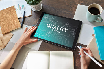 Quality control concept on device screen. Business and technology concept.
