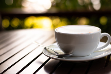 Cup of fresh coffee  break  on wooden table.